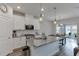 Modern kitchen featuring granite countertops, stainless steel appliances, and stylish pendant lighting at 3410 Summerpoint Xing, Cumming, GA 30028