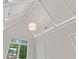 View of an attic bedroom featuring a high, vaulted ceiling with white beams and a large window at 42 Blackland Nw Rd, Atlanta, GA 30342