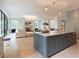 Open concept kitchen with a blue island and marble countertop that opens to the living room at 42 Blackland Nw Rd, Atlanta, GA 30342