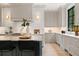 Kitchen featuring white cabinetry, modern appliances, and a large center island with seating at 42 Blackland Nw Rd, Atlanta, GA 30342