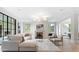 Bright and airy living room featuring a fireplace, large windows, and hardwood floors at 42 Blackland Nw Rd, Atlanta, GA 30342