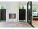 Outdoor living space with a fireplace, gray stone floor, black metal screens, and sliding glass doors at 42 Blackland Nw Rd, Atlanta, GA 30342