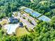 Aerial view of community amenities including tennis courts, playground, clubhouse, and pool at 6690 Bridge Brook Ovlk, Cumming, GA 30028