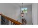 Bright foyer featuring a decorative chandelier and large window, providing natural light and a welcoming entrance at 6690 Bridge Brook Ovlk, Cumming, GA 30028