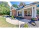 Inviting front porch with classic columns and a beautifully landscaped walkway at 6690 Bridge Brook Ovlk, Cumming, GA 30028