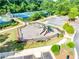 Community playground with slides and play equipment, surrounded by landscaped pathways at 6690 Bridge Brook Ovlk, Cumming, GA 30028