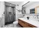 Elegant bathroom boasts modern shower with black fixtures and stylish wood vanity at 1970 Capri Dr, Decatur, GA 30032