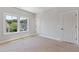Bright bedroom featuring large windows and a closet at 300 Trecastle Ln # 26, Canton, GA 30114