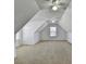 Spacious attic with angled ceilings, carpeted floor, and natural light at 337 Inverness Ave, Mcdonough, GA 30253
