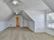 Spacious attic with angled ceilings, carpeted floor, closet, and natural light at 337 Inverness Ave, Mcdonough, GA 30253
