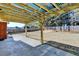 Inviting back patio with concrete, wood pergola, and spacious fenced-in yard for outdoor entertaining at 337 Inverness Ave, Mcdonough, GA 30253