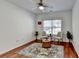 Cozy bedroom with ceiling fan, hardwood floors, a rug, and natural light at 337 Inverness Ave, Mcdonough, GA 30253