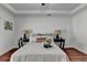 Relaxing bedroom featuring tray ceiling, hardwood floors, stylish furnishings, and ample natural light at 337 Inverness Ave, Mcdonough, GA 30253