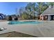 Community swimming pool surrounded by lush trees and greenery for a refreshing escape at 337 Inverness Ave, Mcdonough, GA 30253