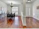 Elegant dining room with hardwood floors, wainscoting, and natural light, ideal for entertaining at 337 Inverness Ave, Mcdonough, GA 30253