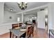 Open-concept dining area with hardwood floors, seamlessly connecting to the living room at 337 Inverness Ave, Mcdonough, GA 30253