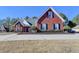 Charming brick home with a well-manicured lawn and mature trees in a desirable neighborhood at 337 Inverness Ave, Mcdonough, GA 30253