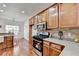 Updated kitchen with granite countertops, stainless steel appliances, wood cabinetry and eat in breakfast area at 337 Inverness Ave, Mcdonough, GA 30253