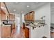 Well-lit kitchen featuring sleek countertops, stainless steel appliances, and wood cabinets with eat in breakfast bar at 337 Inverness Ave, Mcdonough, GA 30253