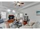 Bright living room with a cozy fireplace, hardwood floors, and plenty of natural light at 337 Inverness Ave, Mcdonough, GA 30253
