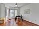 Sunlit office space with hardwood floors, a desk, and natural light from bay windows at 337 Inverness Ave, Mcdonough, GA 30253