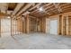 Unfinished basement with exposed beams and concrete flooring at 302 Trecastle Ln # 27, Canton, GA 30114