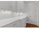 White cabinets and countertop space in this butler's pantry at 302 Trecastle Ln # 27, Canton, GA 30114