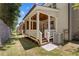 Inviting back porch with wood ceiling, white railings, and view of the backyard at 302 Trecastle Ln # 27, Canton, GA 30114