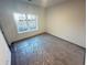 A bedroom that is flooded with natural light through a large window with neutral walls at 3117 Moor View Rd # 36, Duluth, GA 30096