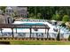 Community pool area with lounge chairs, umbrellas, and well-maintained landscaping at 3117 Moor View Rd # 36, Duluth, GA 30096