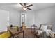 Cozy bedroom offers ample natural light, a comfortable chair, and a functional desk at 343 8Th Ne St # G2, Atlanta, GA 30309