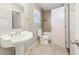 Bathroom featuring modern sink, tile floors and shower at 6071 Cristie Dr, Ellenwood, GA 30294