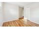 Bedroom with closet, doorway, light walls, and light wood-look flooring at 6071 Cristie Dr, Ellenwood, GA 30294