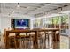 Stylish common area featuring barstool seating at the island, polished concrete floors, and modern lighting fixtures at 878 Peachtree Ne St # 431, Atlanta, GA 30309