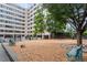 Community dog park with benches and gravel for pets and owners to enjoy at 878 Peachtree Ne St # 431, Atlanta, GA 30309