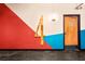 Building hallway with colorful artwork and a door at 878 Peachtree Ne St # 431, Atlanta, GA 30309