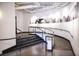 Hallway features stairs and ramp with black railing and artwork on the walls at 878 Peachtree Ne St # 431, Atlanta, GA 30309