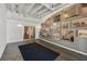 Well-lit lobby featuring a gray accent wall with pictures, concrete floors, and glass door access to exterior at 878 Peachtree Ne St # 431, Atlanta, GA 30309