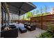 Cozy outdoor patio area with comfortable seating and a privacy fence at 878 Peachtree Ne St # 431, Atlanta, GA 30309