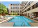 Inviting outdoor pool surrounded by lounge chairs and building views at 878 Peachtree Ne St # 431, Atlanta, GA 30309