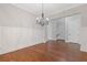 Formal dining room showcasing wainscotting, chandelier, and hardwood floors at 222 Trecastle Sq # 21, Canton, GA 30114