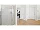 Bathroom featuring a glass-enclosed shower and access to the primary bedroom at 248 Allegrini Dr, Atlanta, GA 30349