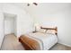 Cozy bedroom featuring neutral walls, carpet and a bed with a decorative comforter at 248 Allegrini Dr, Atlanta, GA 30349