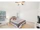 A bedroom with two windows, a ceiling fan, and carpet at 248 Allegrini Dr, Atlanta, GA 30349