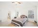 Bright bedroom featuring two windows, neutral walls, carpet and a ceiling fan at 248 Allegrini Dr, Atlanta, GA 30349