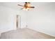 Spacious bedroom with white walls, carpet, and a ceiling fan, ready for personalization at 248 Allegrini Dr, Atlanta, GA 30349