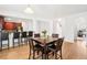 Open concept dining room featuring hardwood floors, a table for six, and natural light at 248 Allegrini Dr, Atlanta, GA 30349