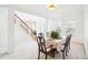 Bright dining room with white walls, carpet, and elegant table setting, perfect for Gathering gatherings at 248 Allegrini Dr, Atlanta, GA 30349