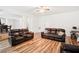 Spacious living room featuring hardwood floors and plenty of comfortable seating at 248 Allegrini Dr, Atlanta, GA 30349