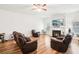 Spacious living room featuring a fireplace, hardwood floors, and plenty of natural light at 248 Allegrini Dr, Atlanta, GA 30349